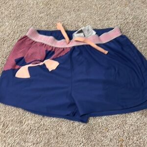 UA youth XL shorts two small holes in the back. Please see photos